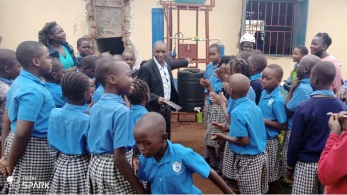 Dr. Jimmy Byakatonda at Gulu University explains the new system to school students.